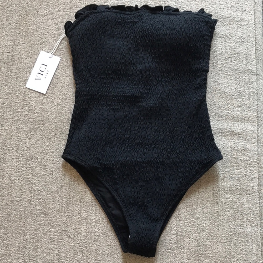 Black smocked one piece bathing suit never worn
